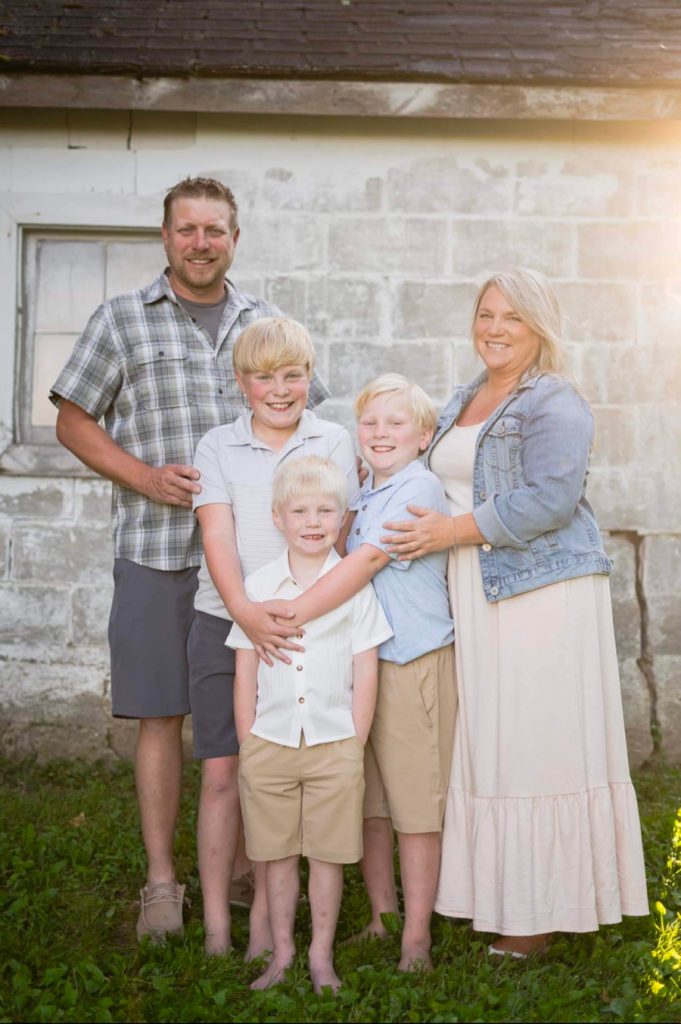 Photo of Dan, wife, and three sons