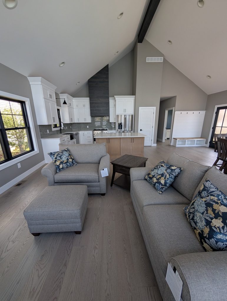 Living room open to the white kitchen at The Lake House