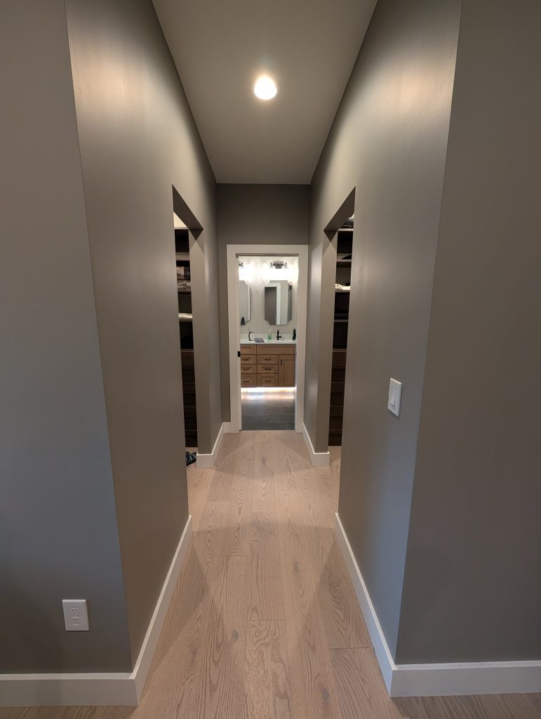 Hallway leading to the primary suite at The Lake House