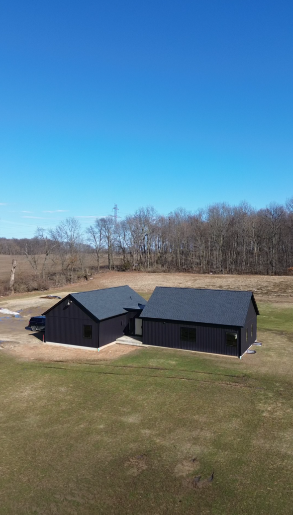 Aerial view of The Still House on an open lot